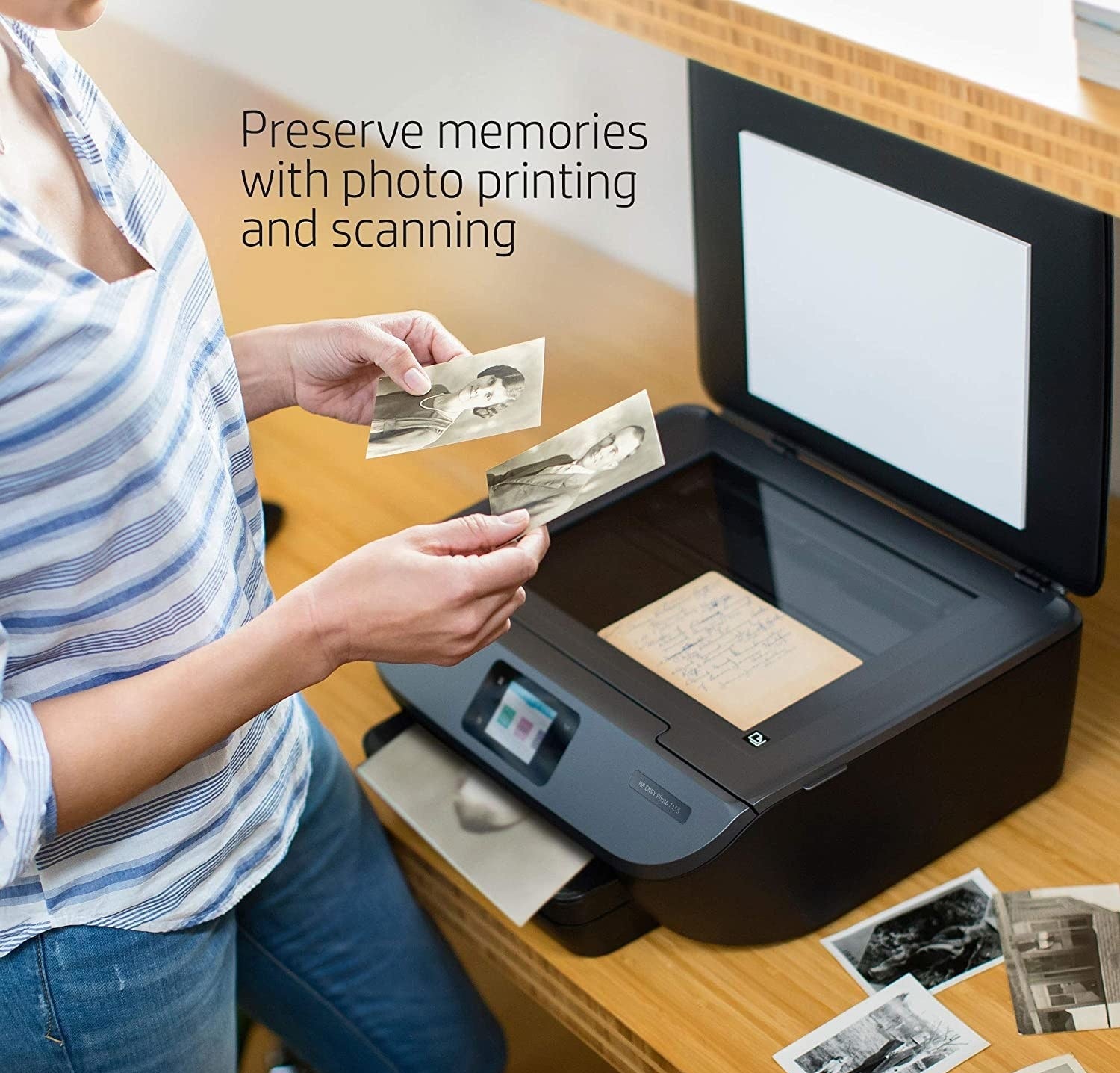 person scanning old family photos on the printer