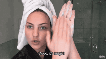 A GIF of someone rubbing face cleanser in their hand and saying ooh it&#x27;s magic