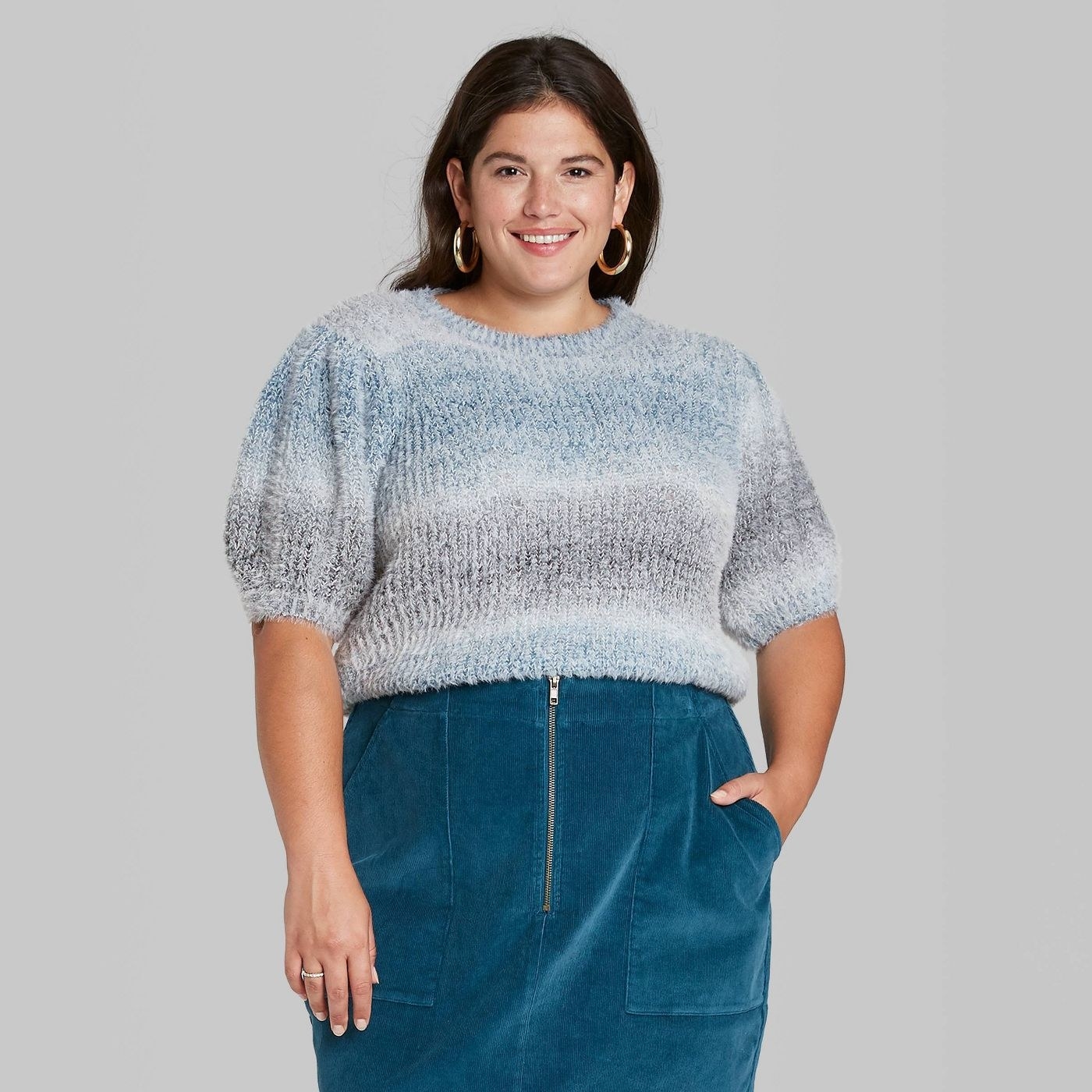 model wearing fuzzy ombre sweater
