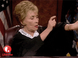 Judge Judy tapping her watch and hitting her bench to speed up someone in her court