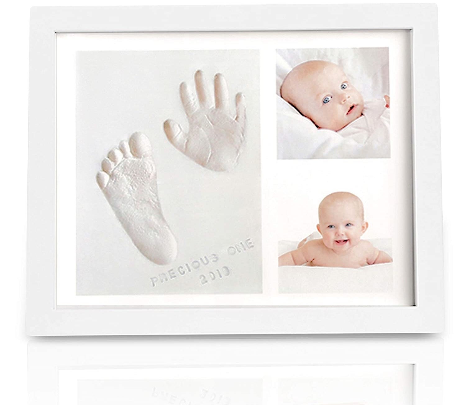 White frame with baby photos and hand and footprint