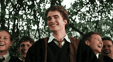 Gif of Cedric Diggory and his friends laughing. 