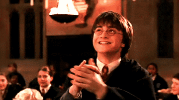 Gif of Harry Potter laughing and clapping. 