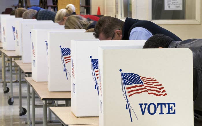 People voting on tables in a room