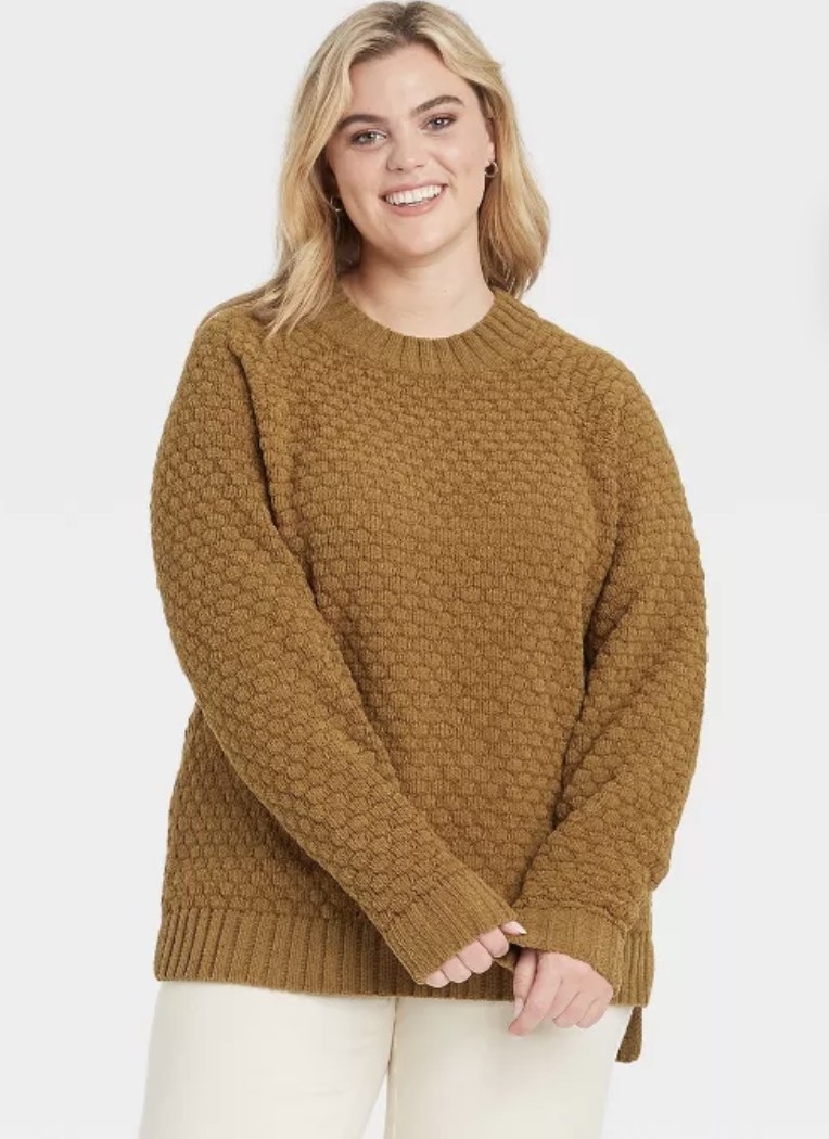 model wearing a greenish texturized sweater