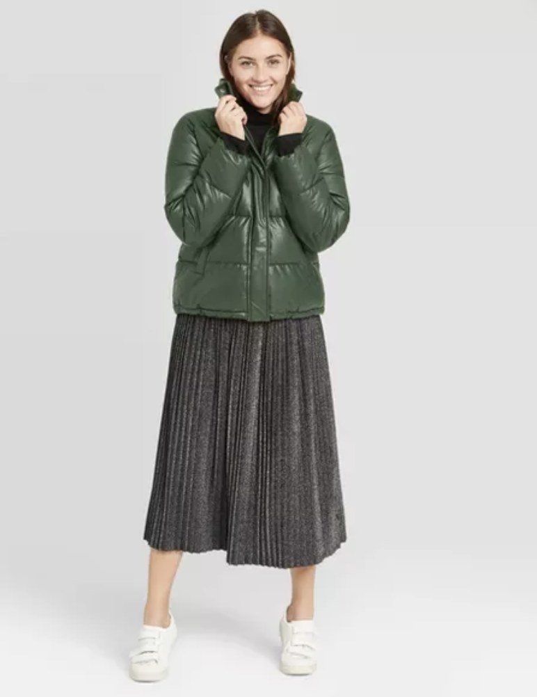 model wears green leather puffer jacket