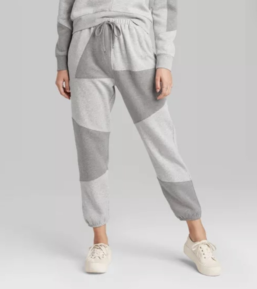 model wears gray patchwork jogger pants 