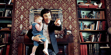 Sherlock holding John&#x27;s baby and waving