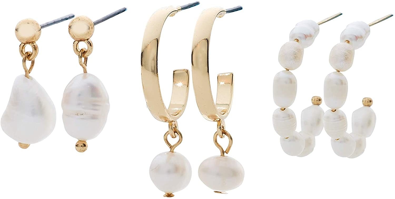 The three pairs of earrings: gold studs with dangling baroque pearls, gold open hoops with dangling small round pearls, and baroque pearl open hoops