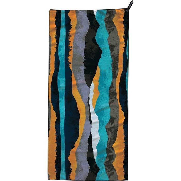 the towel in a black, orange, teal, gray and white pattern 