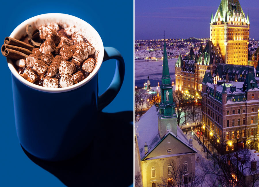 A mug of hot cocoa with marshmallows and a snowy scene from Quebec City.