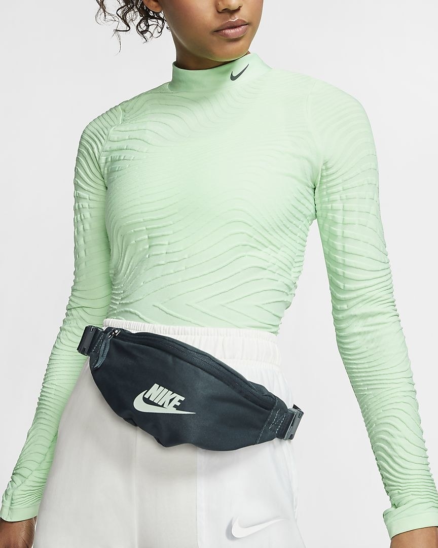 Model wearing a seaweed colored hip pack