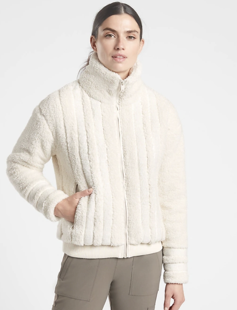 Model wears Willow Fleece coat in natural