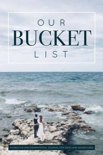 The cover of the bucket list book with a couple standing on rocks overlooking an ocean