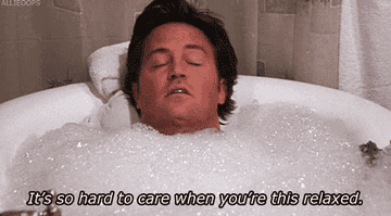 man taking a bath with words &quot;it&#x27;s so hard to care when you&#x27;re this relaxed&quot;