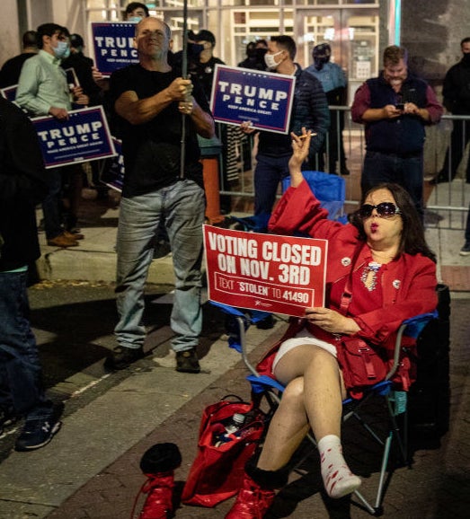 Pennsylvania Trump supporter who (incorrectly) believes that &quot;voting closed on Nov. 3rd&quot; sits in a lawn chair while holding her sign and smoking a cigarette