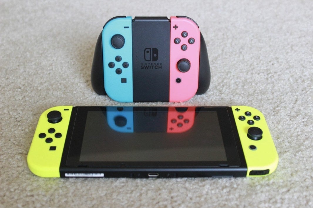 A Nintendo Switch with neon yellow Joy-Cons