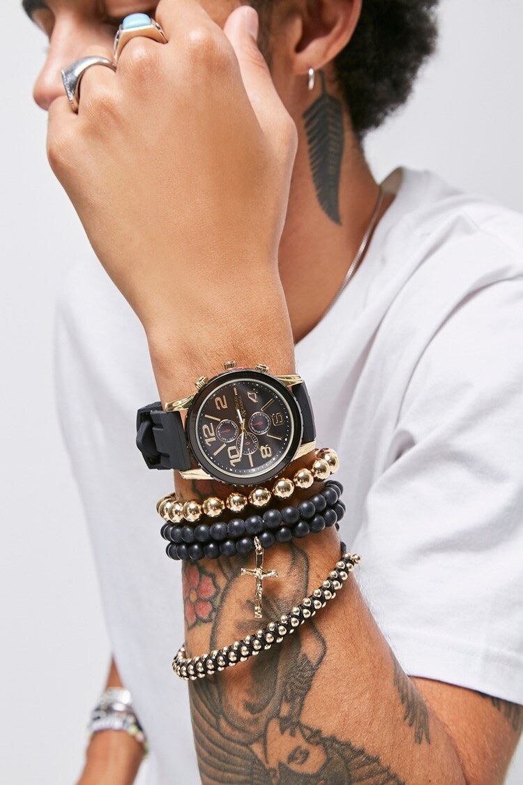 Model wearing watch and bracelets