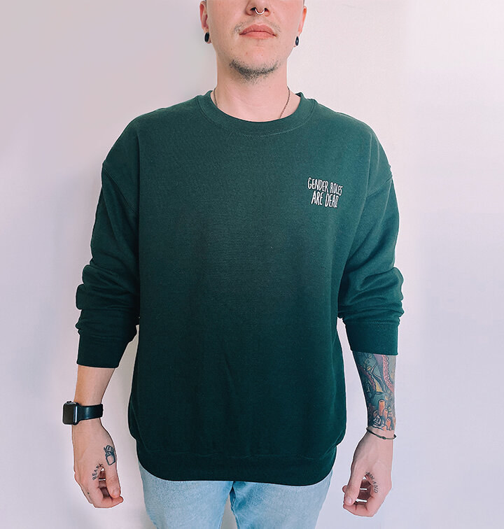 a model wearing the green sweater 