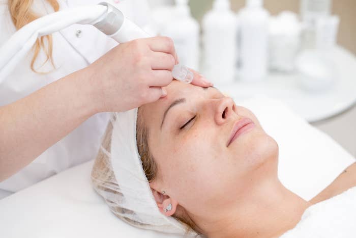 Women getting a microdermabrasion treatment at a beauty salon