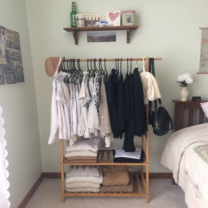 reviewer photo of rack, holding lots of clothes 