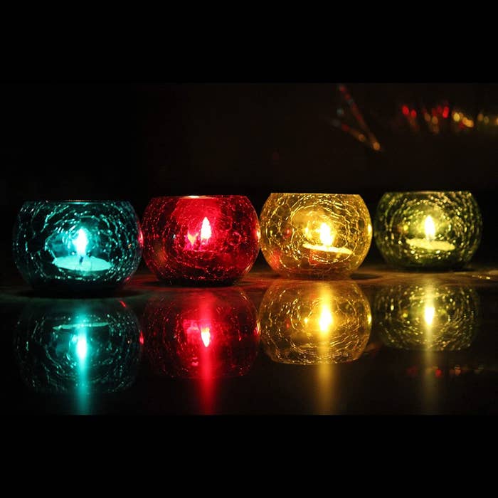 Crackled glass candle holders in blue, red, yellow, and green.