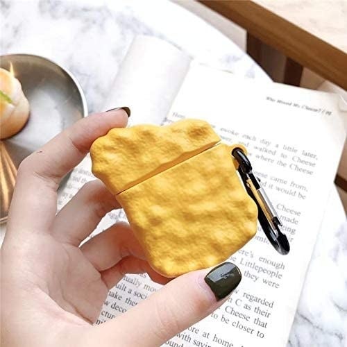 A person holding an earbuds case that has a silicone skin in the shape of a chicken nugget