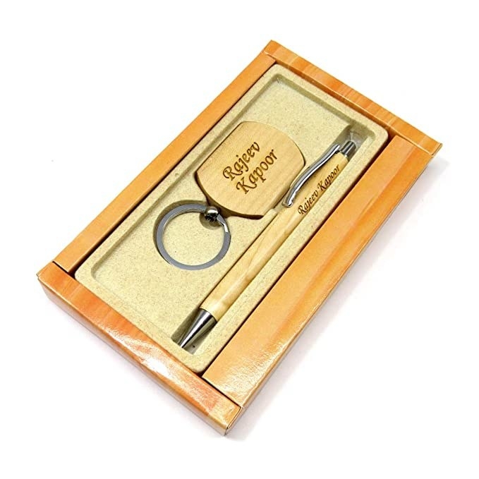 Pen and keychain set in a wooden box.