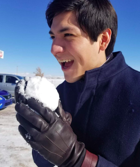 reviewer wearing leather cashmere-lined gloves holding a snow ball