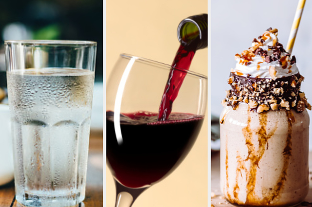 A cup of water is on the left with wine in the center and a milkshake on the right