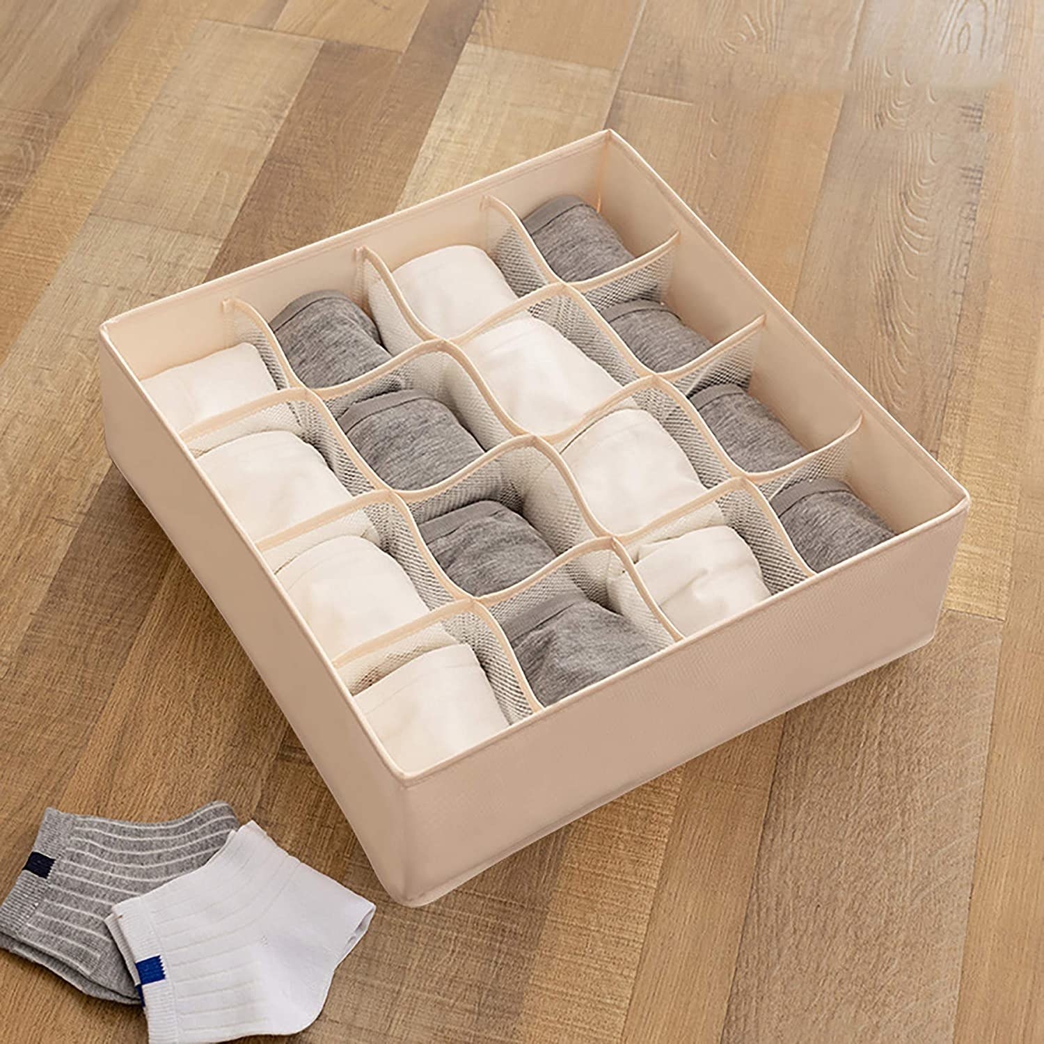 The sock organizer filled with neatly folded pairs of socks