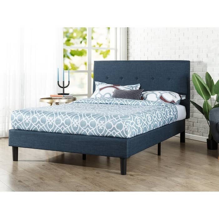 The navy platform bed in use 