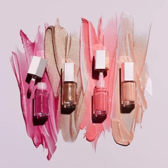 The four mini lipglosses in three shades of pink and gold