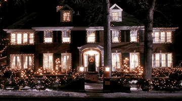 Home Alone house twinkles with Christmas lights.