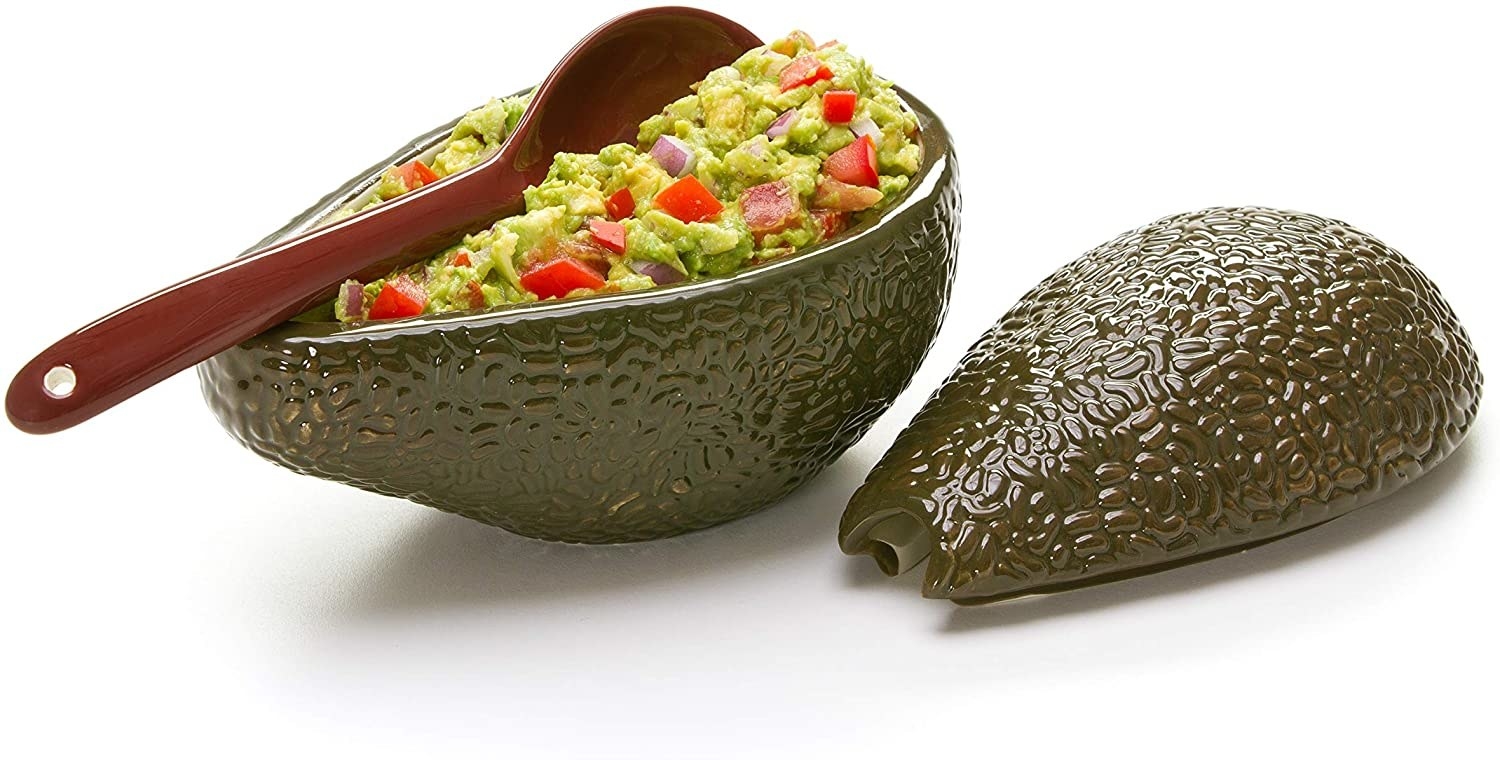 avocado shape bowl with guacamole in it 