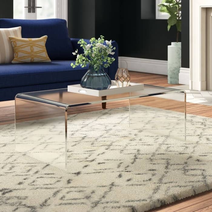 The clear coffee table in a living room