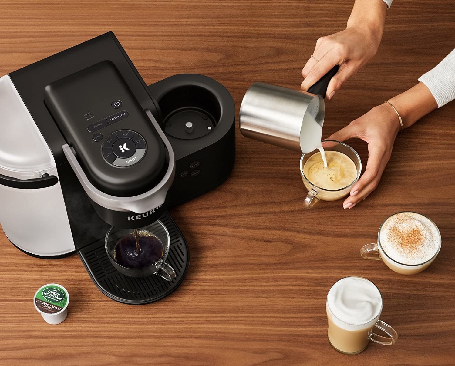 The black Keurig coffee maker pouring an espresso shot