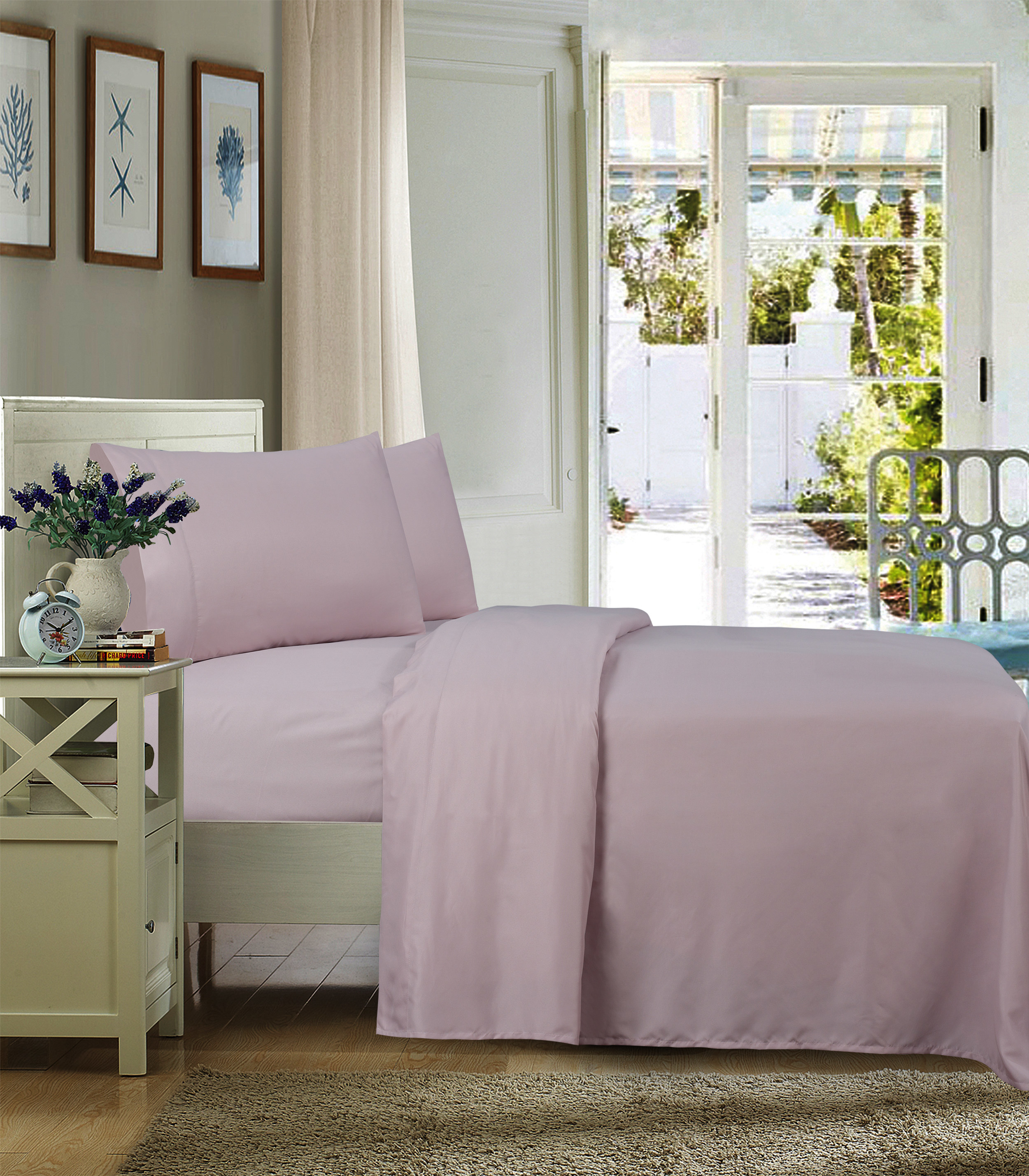 The sheets on a bed in a light pink shade