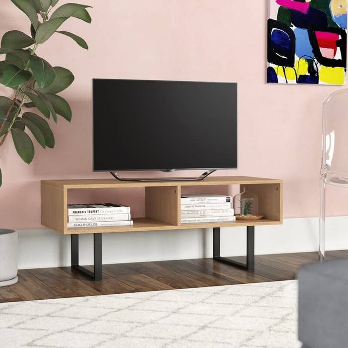 The brown TV stand in use 