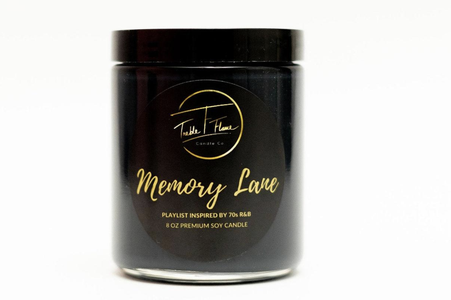 A black candle that says &quot;Memory Lane&quot; in gold 