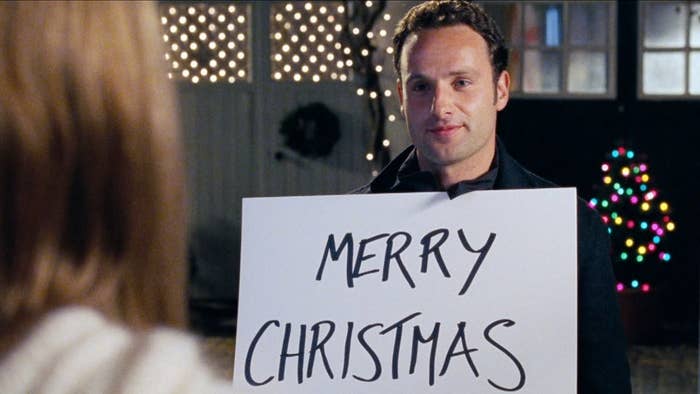 Actor Andrew Lincoln in the movie &#x27;Love Actually&#x27; holding up a sign that says &quot;Merry Christmas&quot;