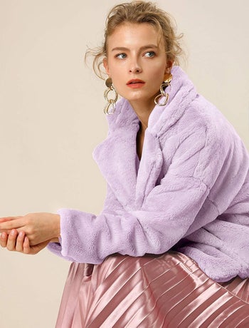 A model wearing the jacket in lilac
