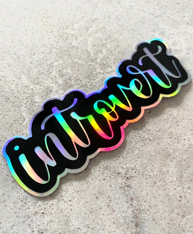 A colourful sticker that says introvert