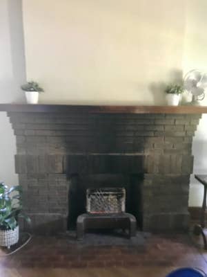 A customer review photo of their soot-covered fireplace mantel