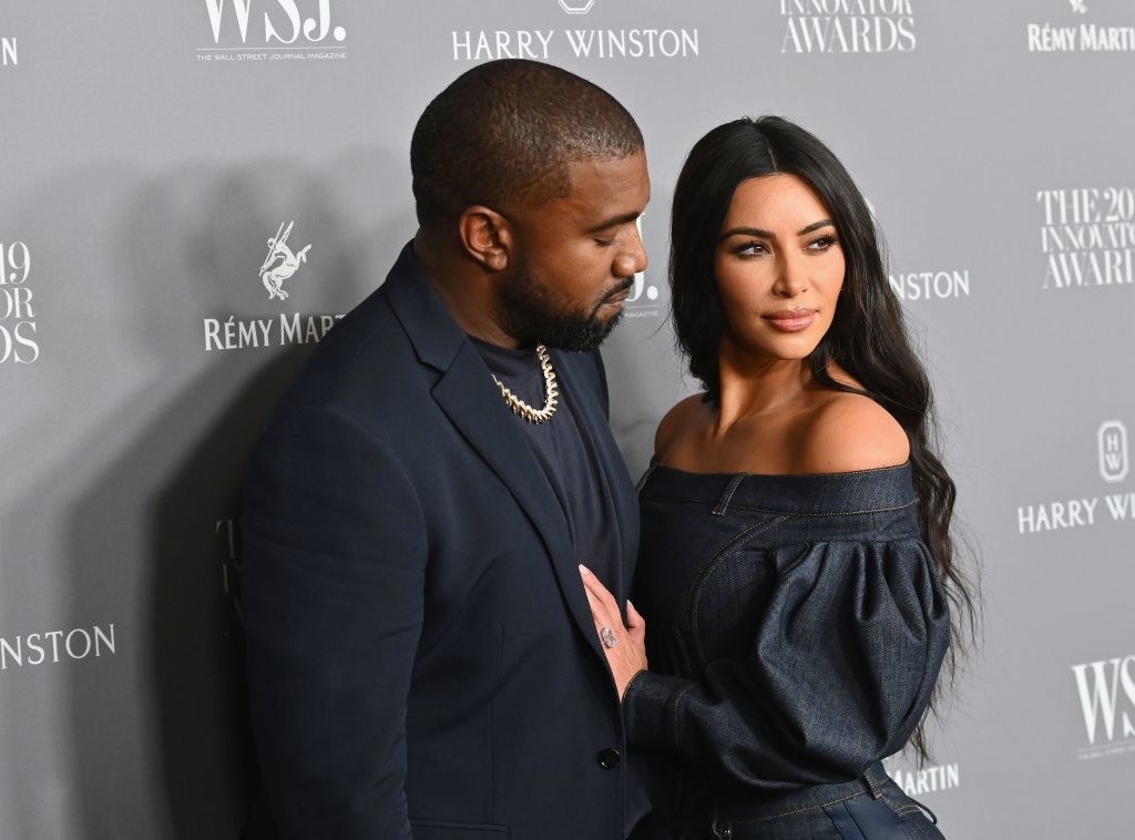 Kim Kardashian and Kanye West posing on the red carpet of the WSJ. Innovators Awards 2019