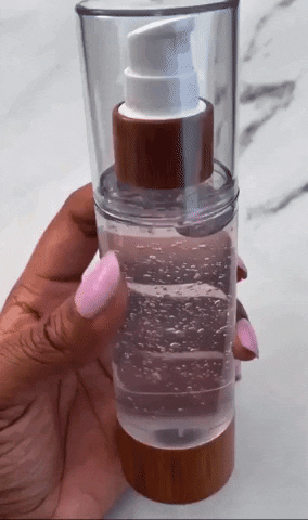 hand holding the bottle of the mask solution