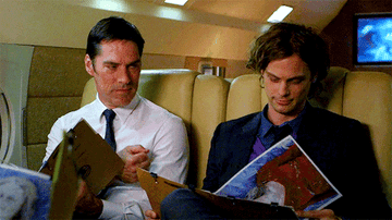 Spencer and Hotch fist-bumping. 