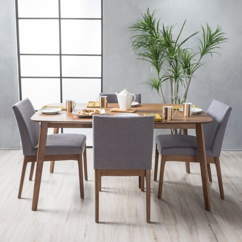 gray chairs with walnut table