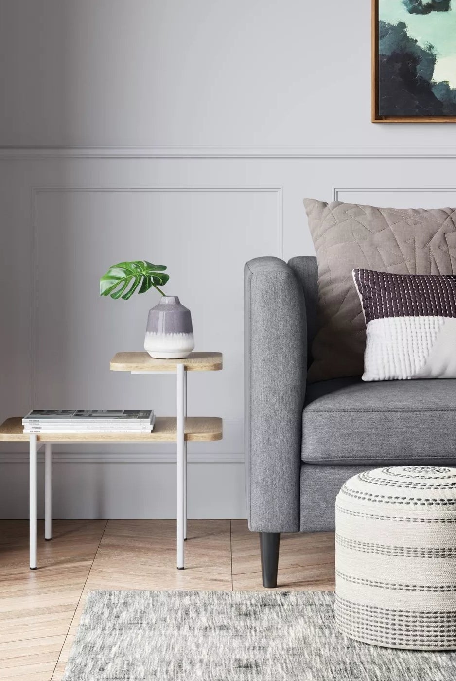 The pouf in front of a couch in a living room