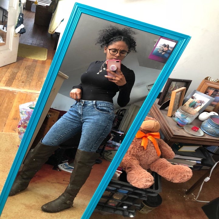 reviewer wearing it with jeans and boots